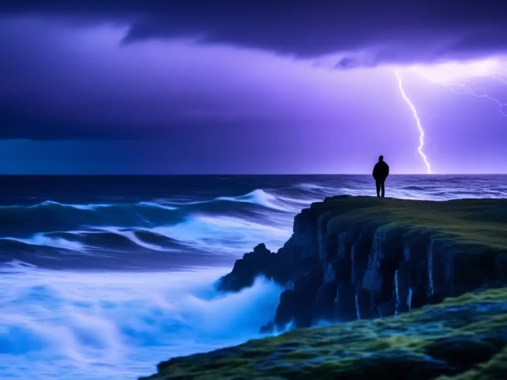 A lone figure stands on a rocky outcrop, silhouette stark against the stormy ocean horizon